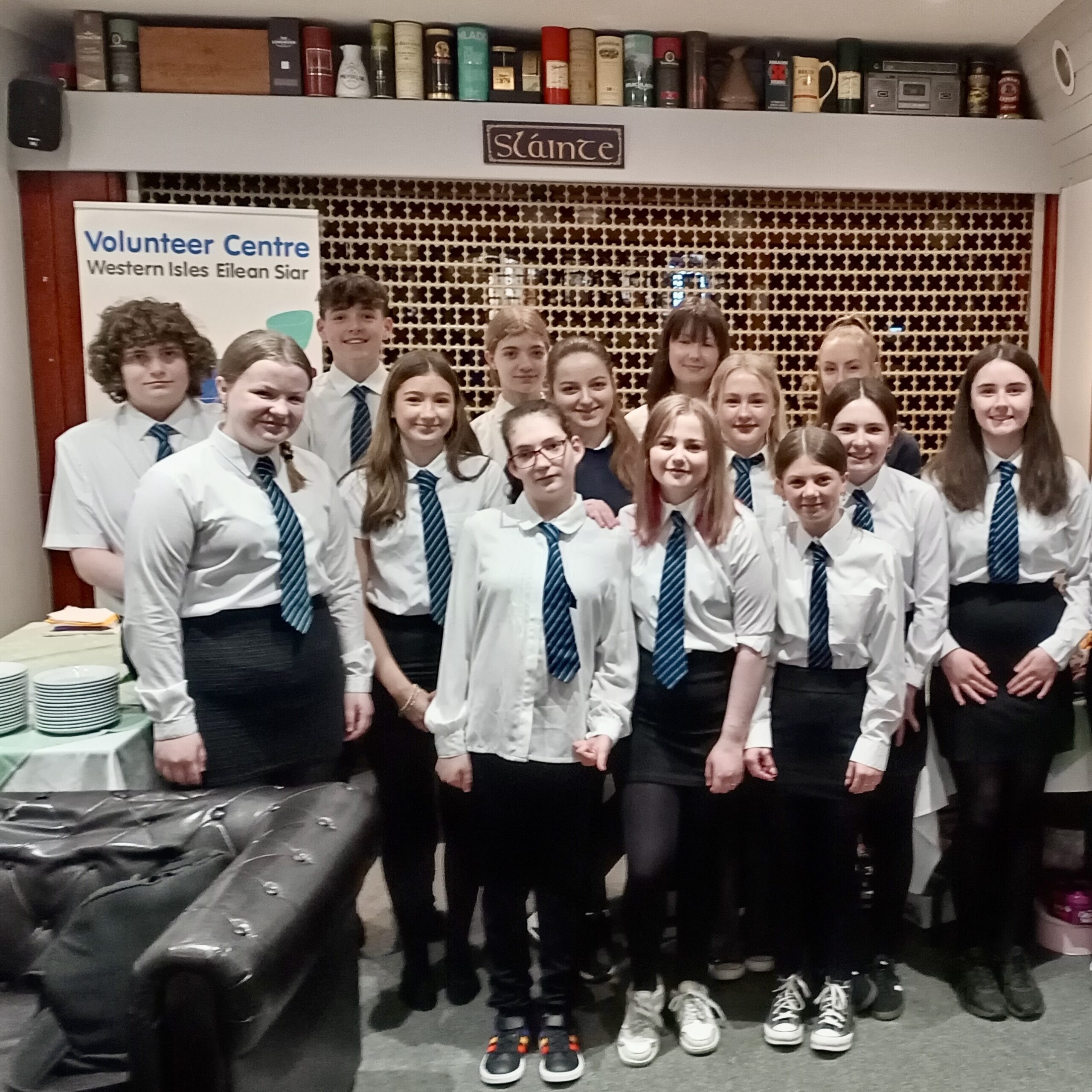 Group of students from Sir E Scott School involved in running a community coffee morning.